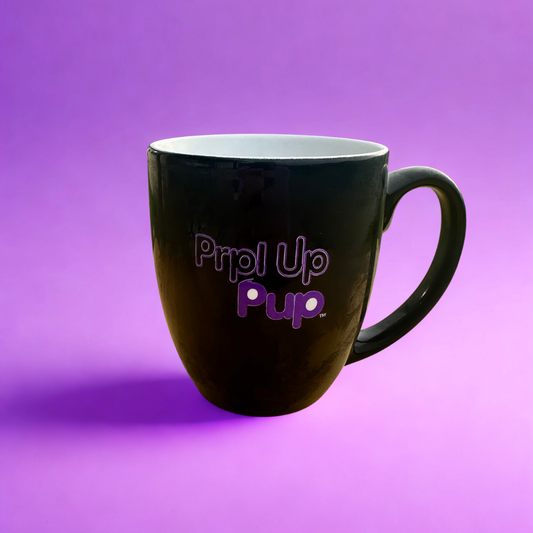 Black 16 oz mug with a light purple background. Illustrations from the world of Prpl Up Pup.
