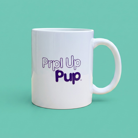 A white ceramic coffee mug with the text 'Prpl Up Pup' printed in purple on the side, set against a solid mint green background.