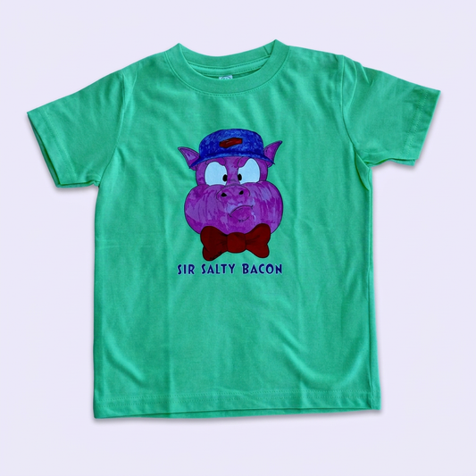 Green Sir Salty Bacon kids' T-shirt with Pig 1 artwork on a pale lavender background