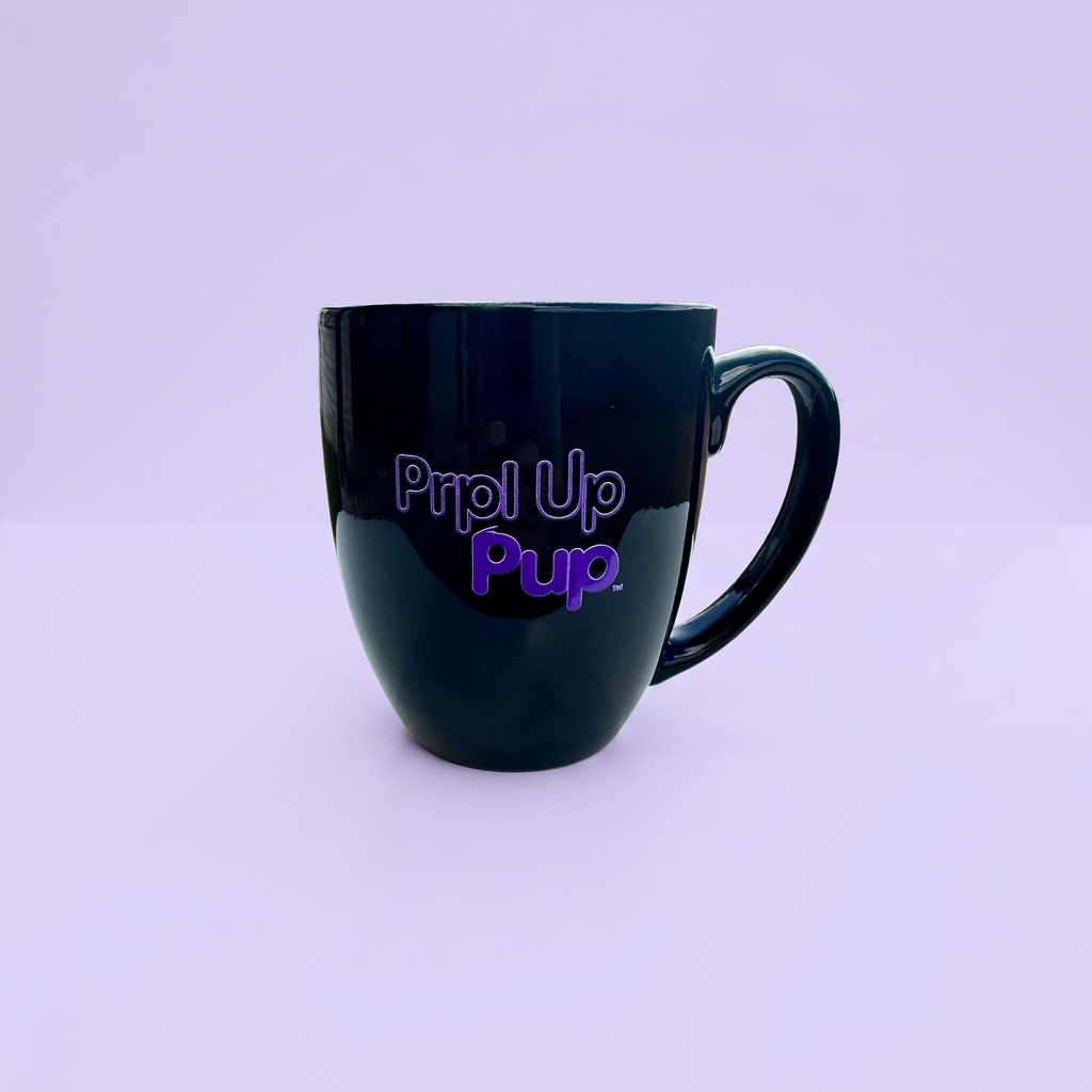 Black Pup mummy costume mug on a light lavender background, logo view