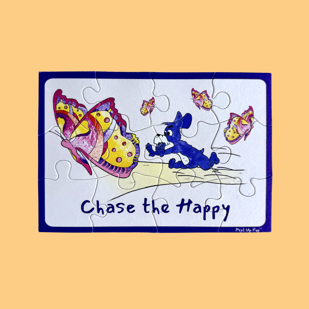 Children's puzzle with a cartoon purple dog, Prpl Up Pup, chasing butterflies and 'Chase the Happy' text on a beige background.