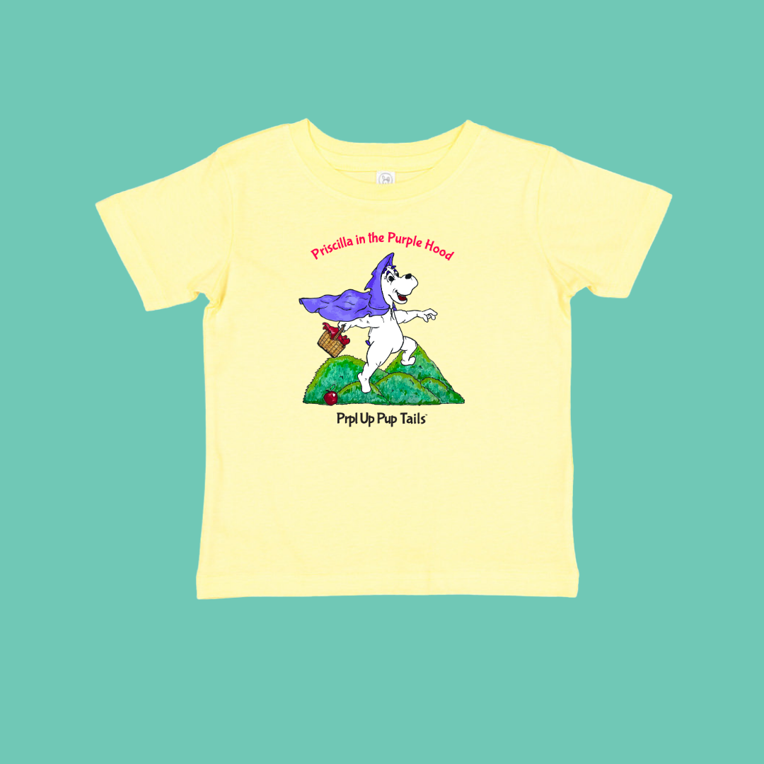 Yellow t-shirt with a white cartoon dog design on a teal background. Inspire by Priscilla in the Purple Hood picture book for kids 5-10.