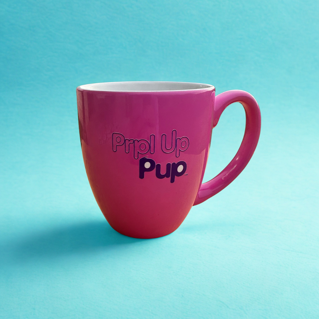 Hot pink 16 oz mug with a light blue background. Prpl Up Pup text on the back of the mug.