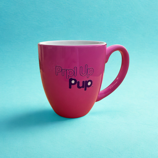 Hot pink 16 oz mug with a light blue background. Prpl Up Pup text on the back of the mug.