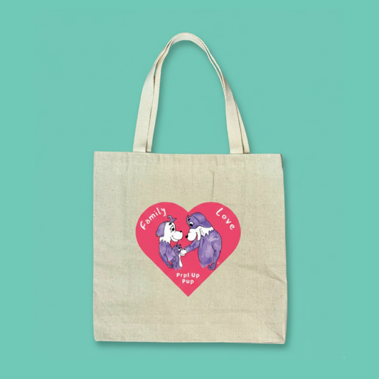 Canvas tote bag with cartoon dog in a heart design on a teal background. The purple cartoon dogs are the Prpl Up Pup family.