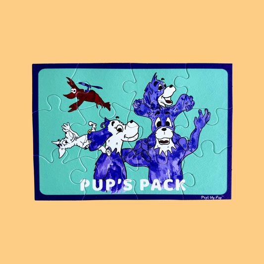 Jigsaw puzzle with cartoon dogs on a blue background, labeled 'Pup's Pack', on a beige background.
