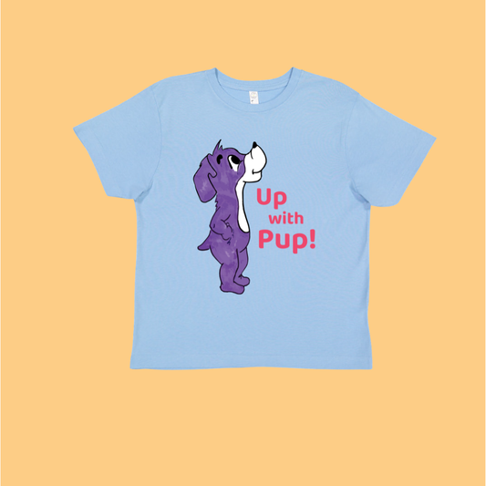 Light blue t-shirt with a purple cartoon dog and text on a light orange background. This is Prpl Up Pup, a purple dog cartoon character from the Up, Up, Pup! picture book.