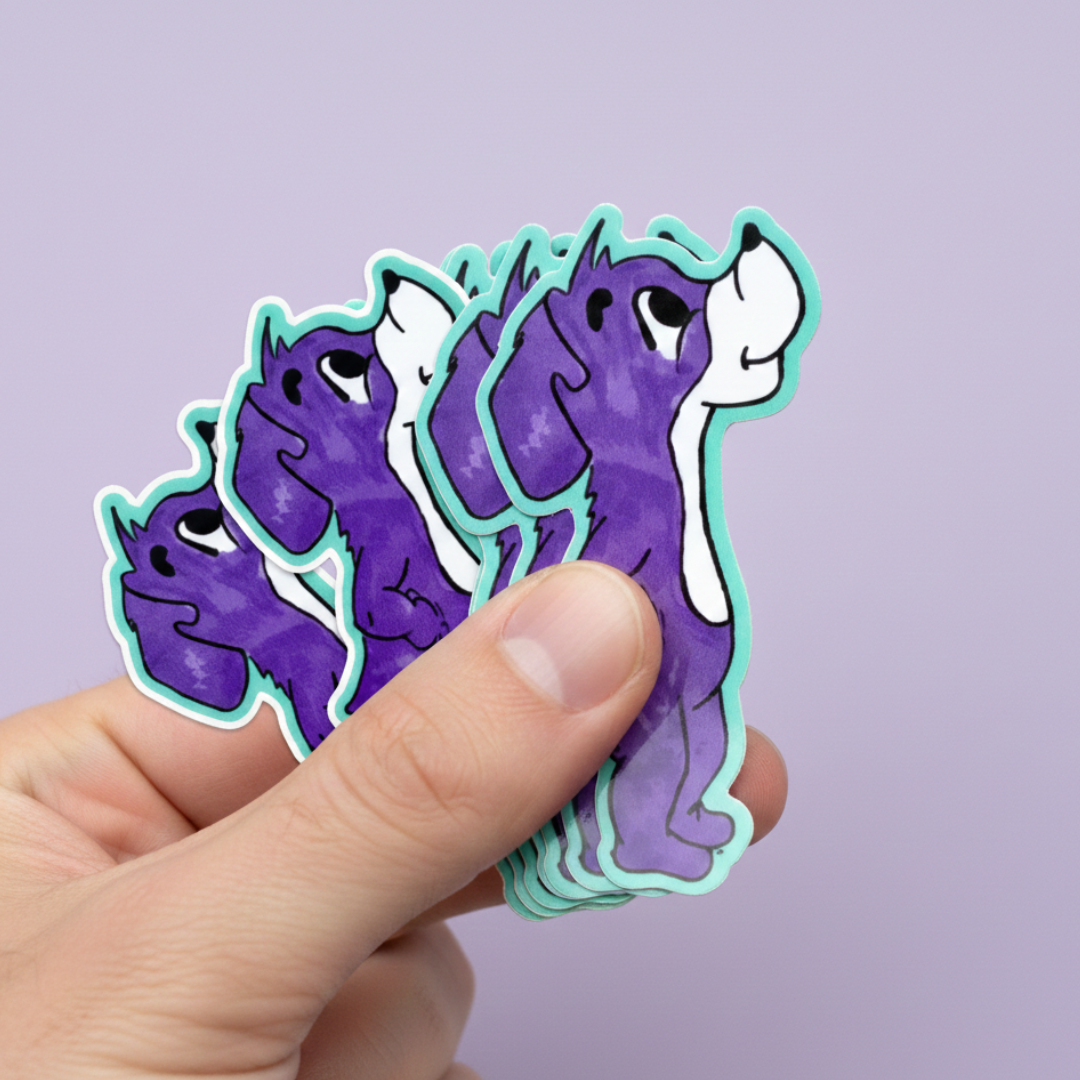 Hand holding a stack of purple and green dog cartoon-like animal stickers against a light purple background. This Prpl Up Pup die-cut sticker. 