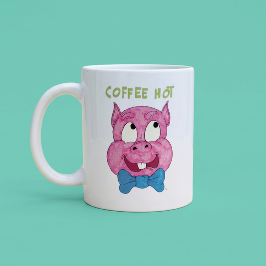 White Pig 3 mug with a pink pig, blue bow tie and green COFFEE HOT lettering on a teal background.